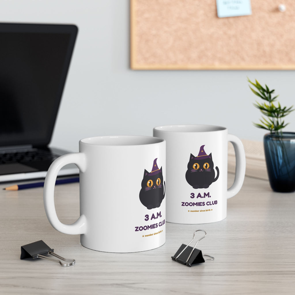 Hex Zoomies Club mugs on a desk