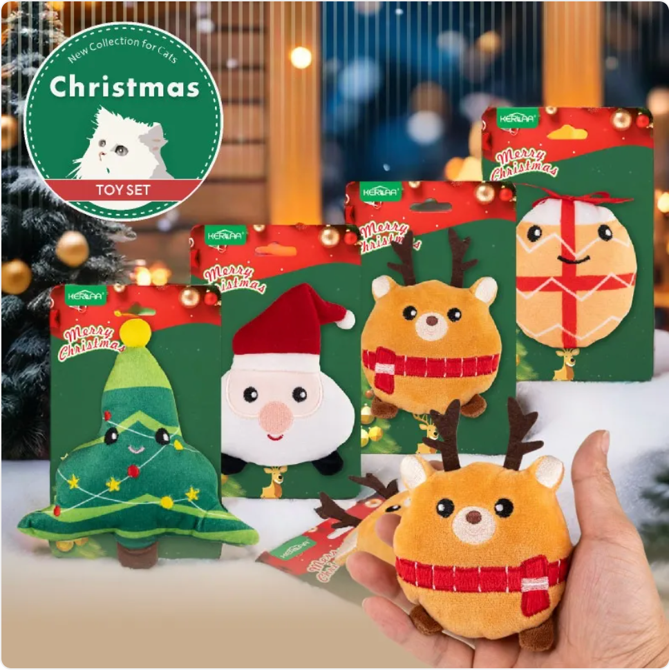 Hand holding the Christmas plush cat toys