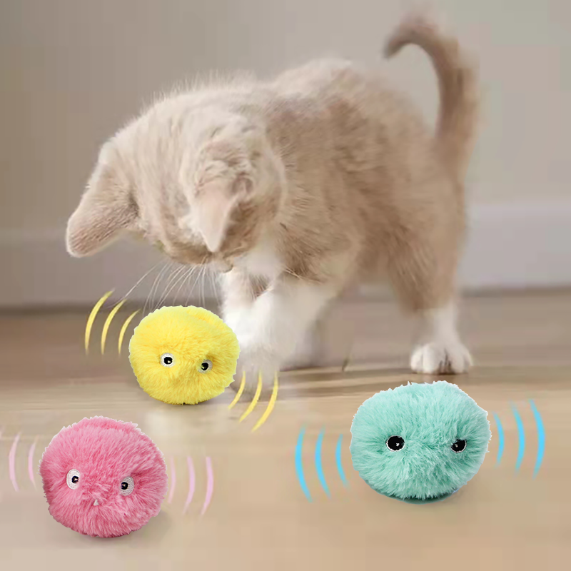 Kitten playing with the chirping catnip balls