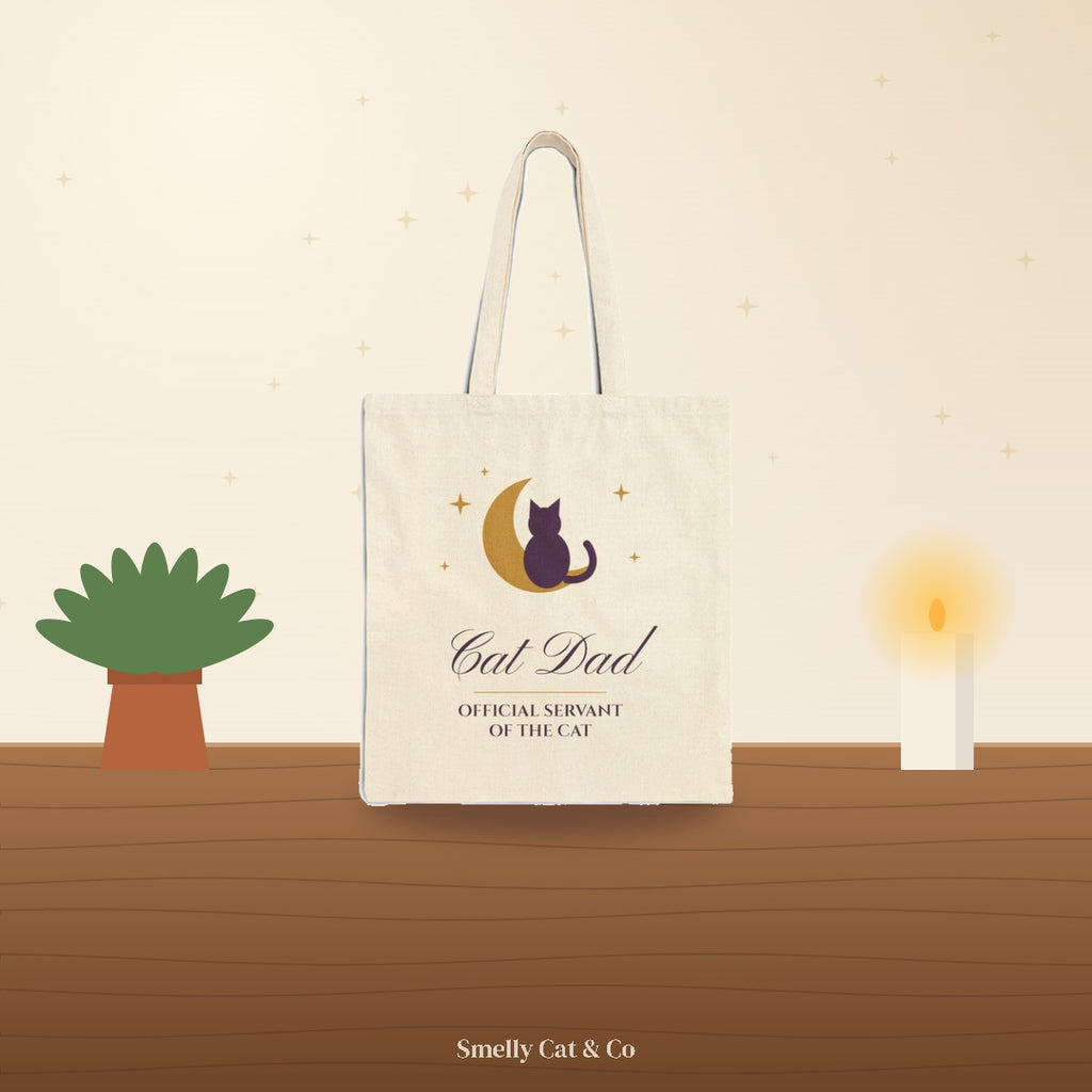 Cat Dad tote bag on a cozy wooden table (product photo on an illustrated background)