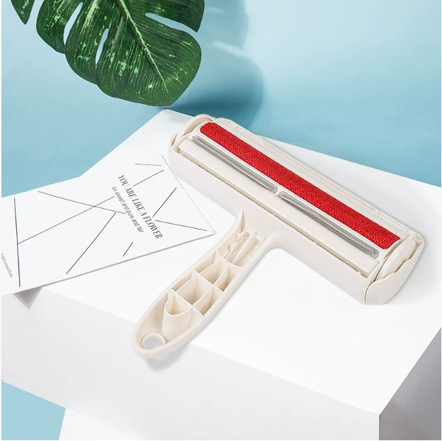 Reusable hair remover roller on a white table