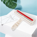 Reusable hair remover roller on a white table