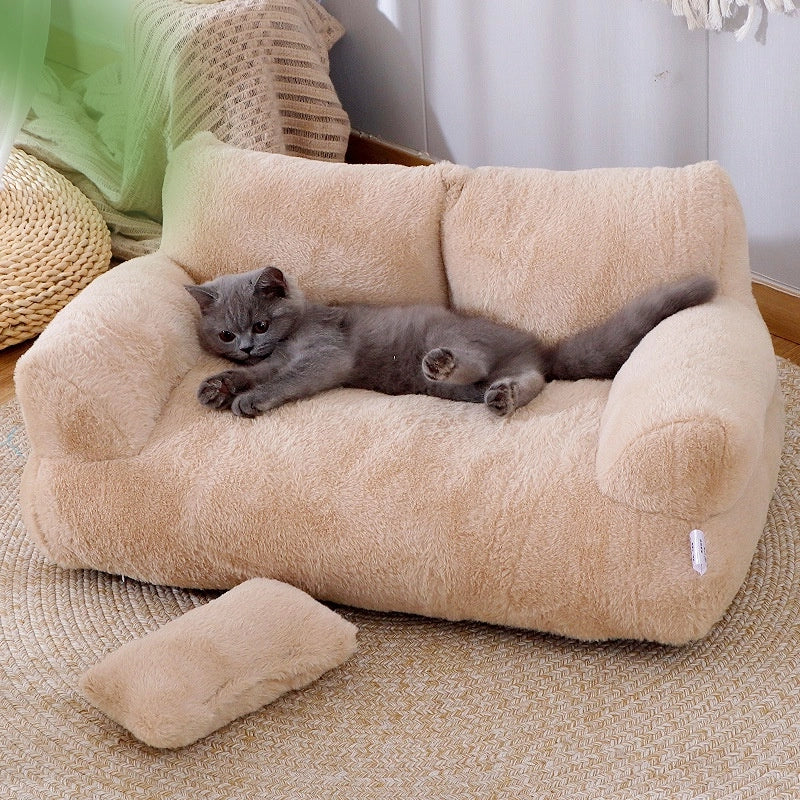 Gray cat stretched out on the tan Luxury Plush Cat Bed, with a loose cushion on the floor in front
