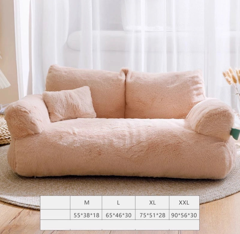 Luxury Plush Cat Bed in light tan on a round rug in a bright room, with sizes M to XXL listed below