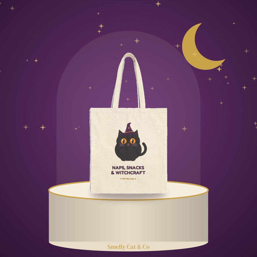Hex tote bag on a cream podium under a gold moon (product photo on an illustrated background)